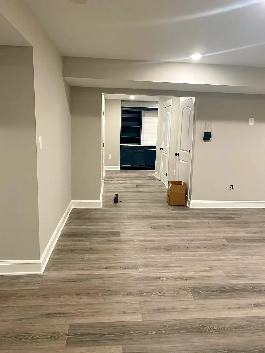 Finished-basement luxury vinyl, flooring project in Northern Virginia by HOM Design & Build, view 1
