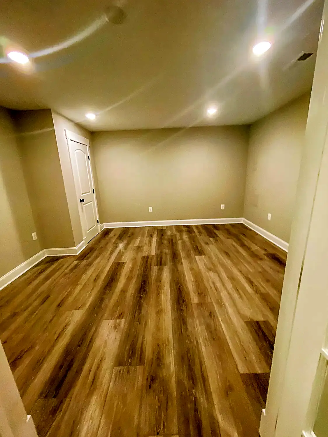 Finished-basement luxury vinyl, flooring project in Northern Virginia by HOM Design & Build, view 2