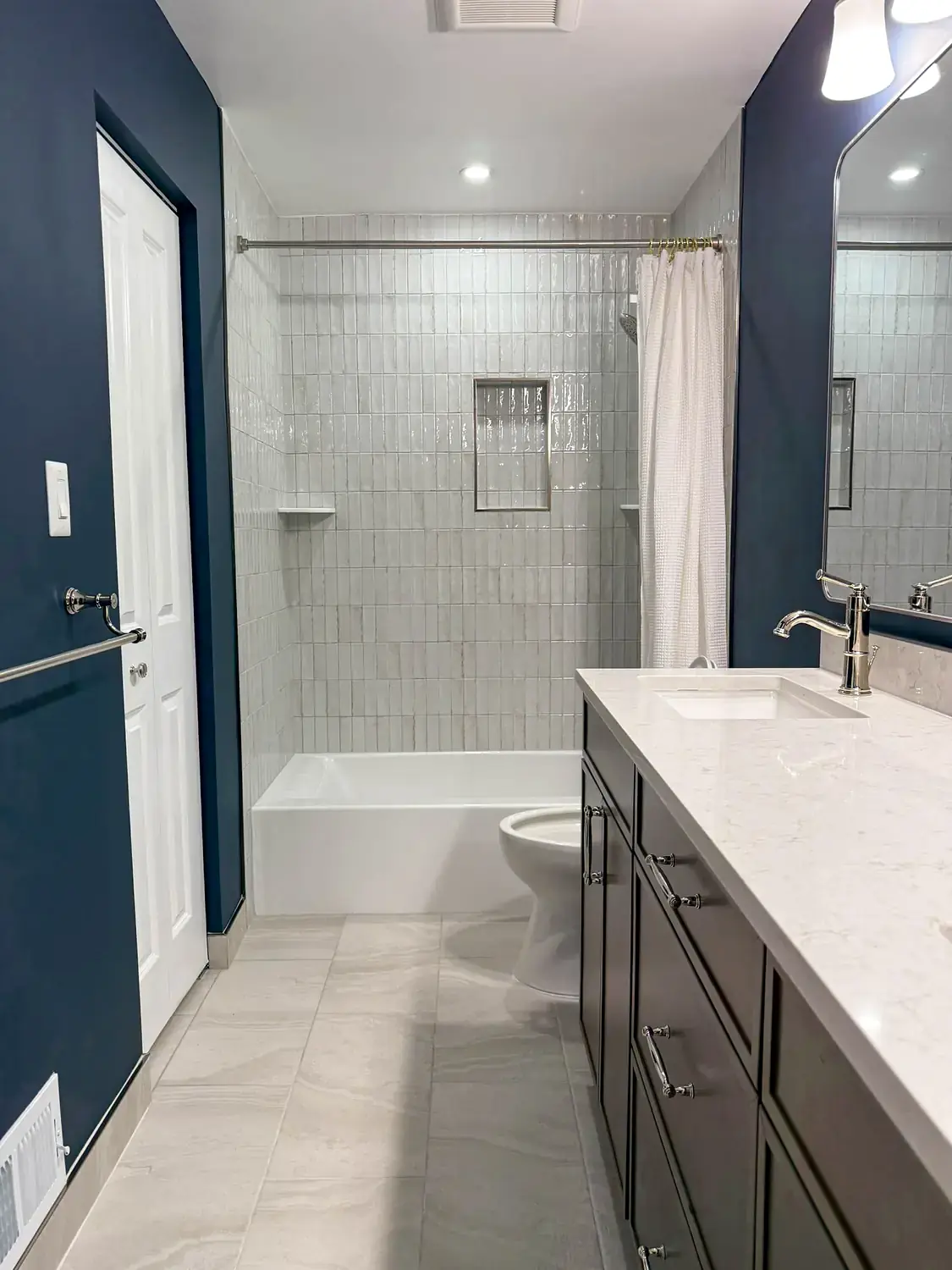 Finished bedroom and bathroom suite, basement finishing project in Northern Virginia by HOM Design & Build, view 1