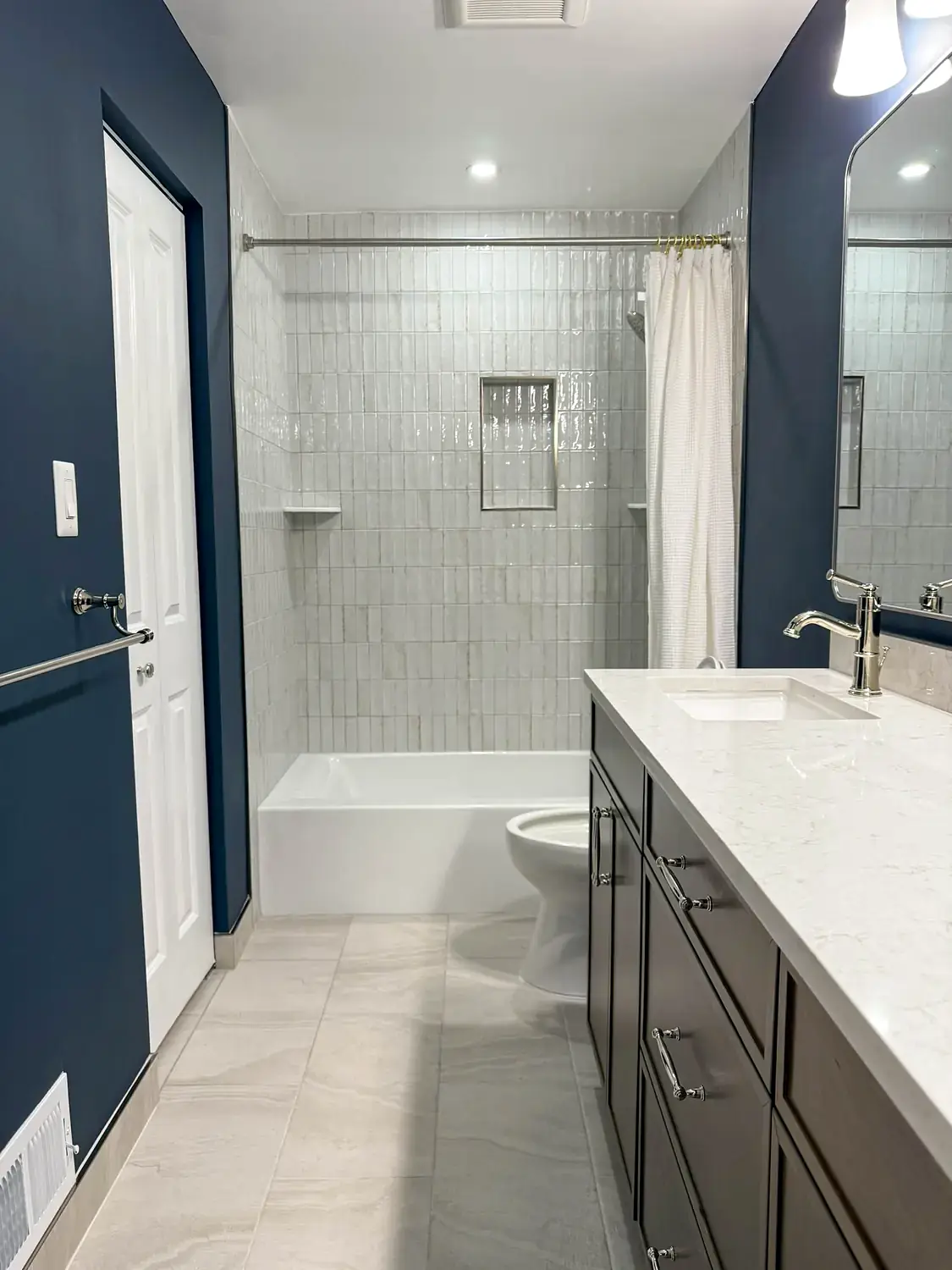 Finished bedroom and bathroom suite, basement finishing project in Northern Virginia by HOM Design & Build, view 2