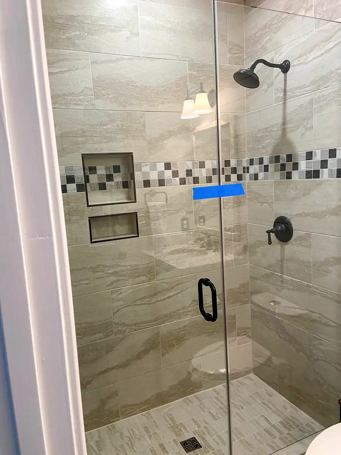 Glass shower and freestanding tub, bathroom remodeling project in Northern Virginia by HOM Design & Build, view 1