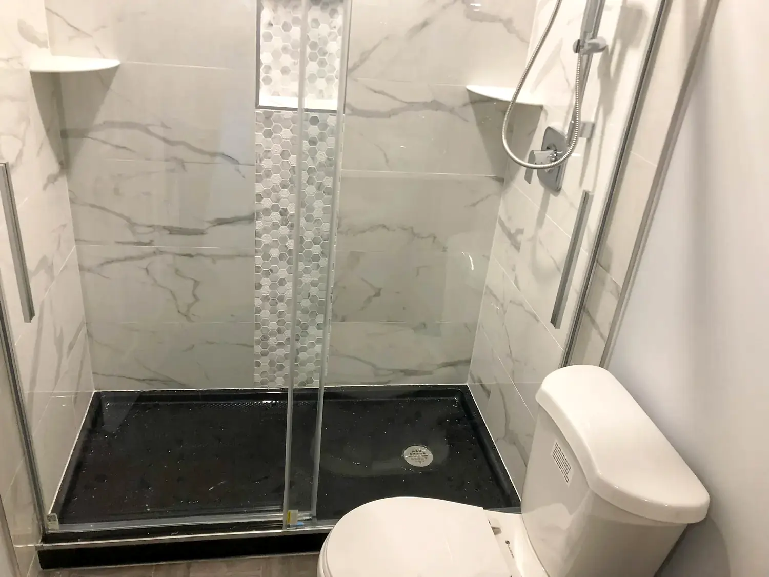 Marble-look walk-in shower, bathroom remodeling project in Northern Virginia by HOM Design & Build, view 5