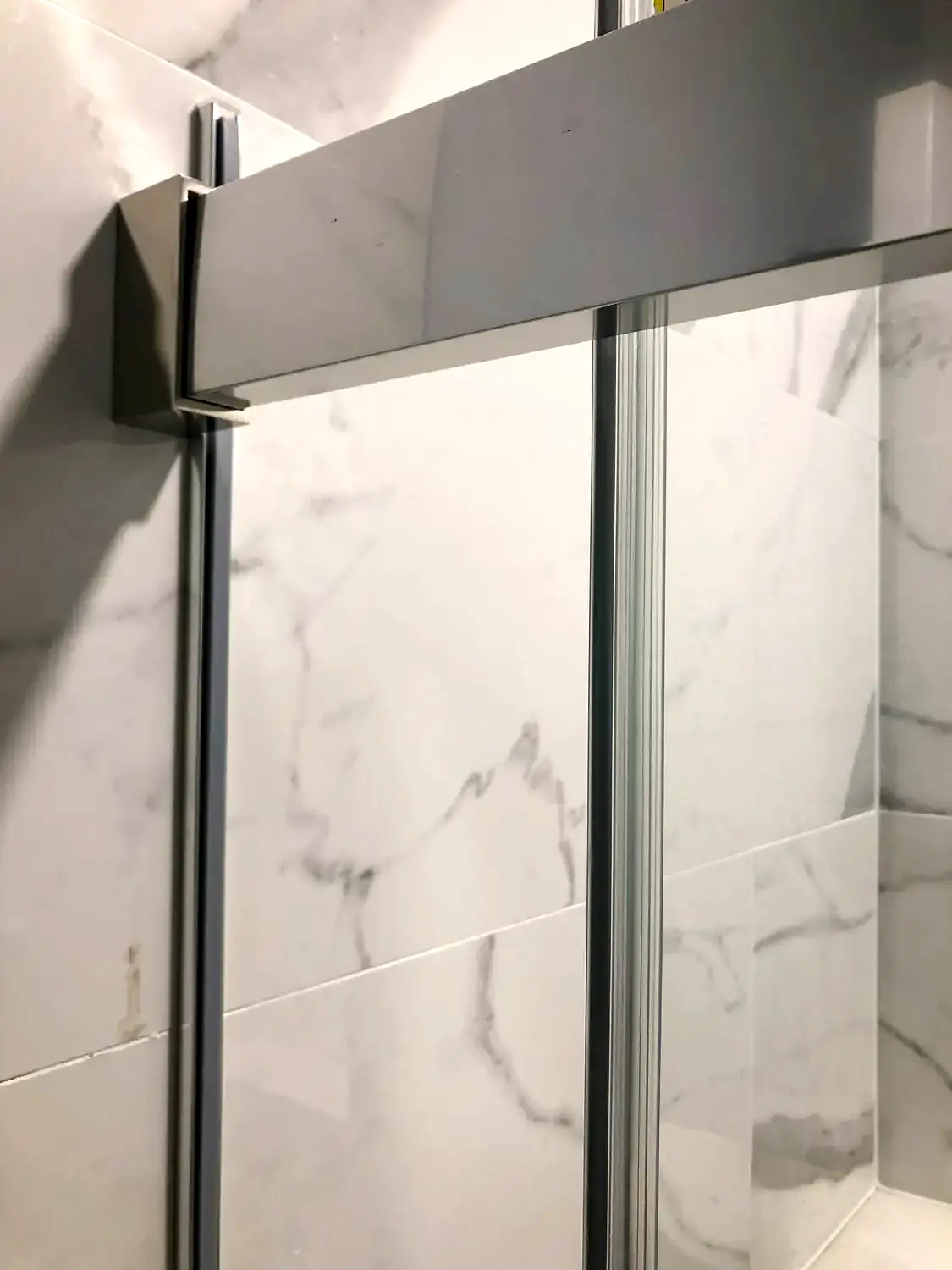 Marble-look walk-in shower, bathroom remodeling project in Northern Virginia by HOM Design & Build, view 9