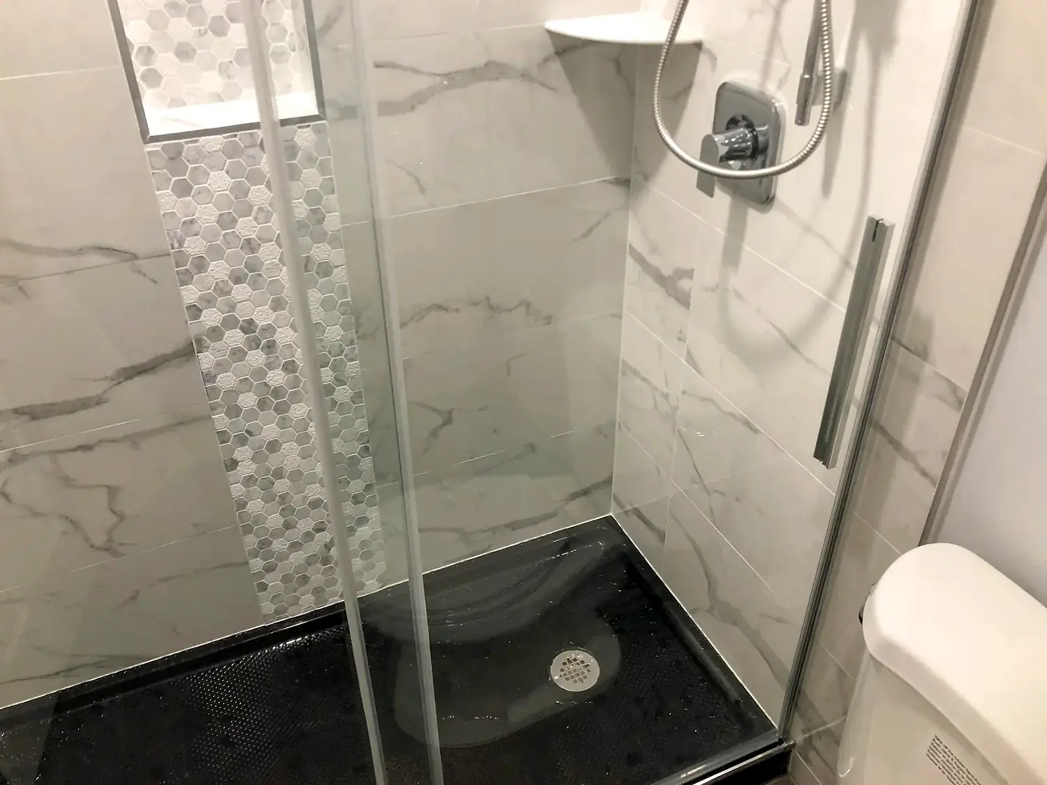 Marble-look walk-in shower, bathroom remodeling project in Northern Virginia by HOM Design & Build, view 11