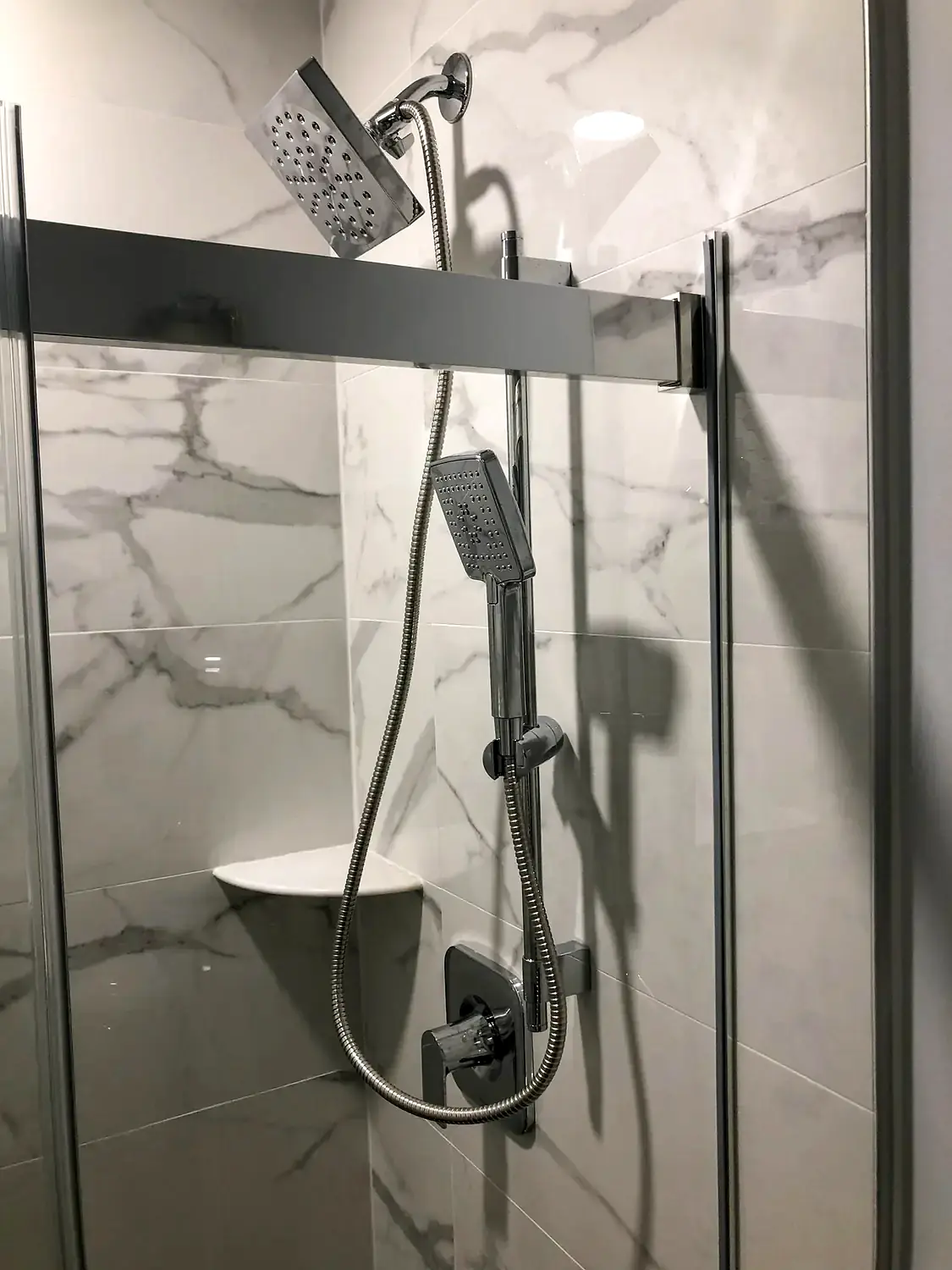 Marble-look walk-in shower, bathroom remodeling project in Northern Virginia by HOM Design & Build, view 12