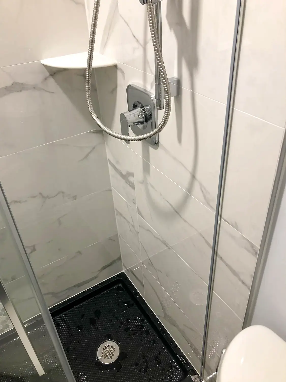 Marble-look walk-in shower, bathroom remodeling project in Northern Virginia by HOM Design & Build, view 13