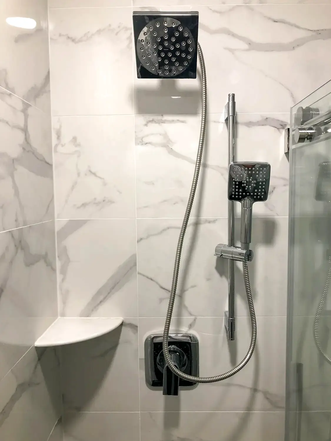 Marble-look walk-in shower, bathroom remodeling project in Northern Virginia by HOM Design & Build, view 14