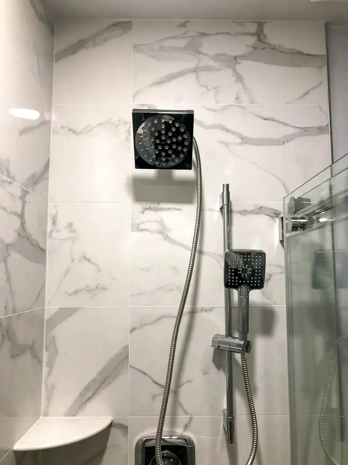 Marble-look walk-in shower, bathroom remodeling project in Northern Virginia by HOM Design & Build, view 15