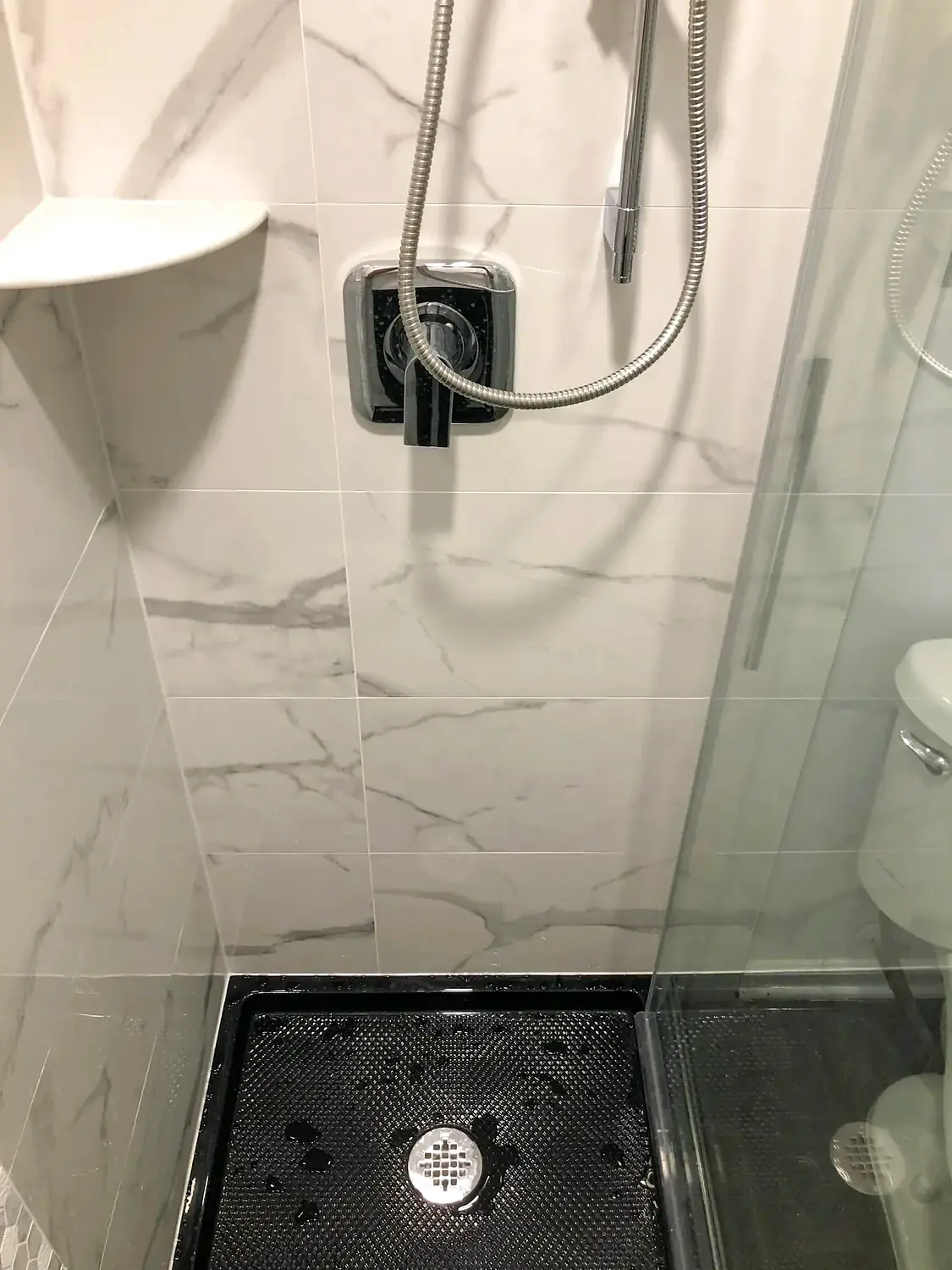 Marble-look walk-in shower, bathroom remodeling project in Northern Virginia by HOM Design & Build, view 16