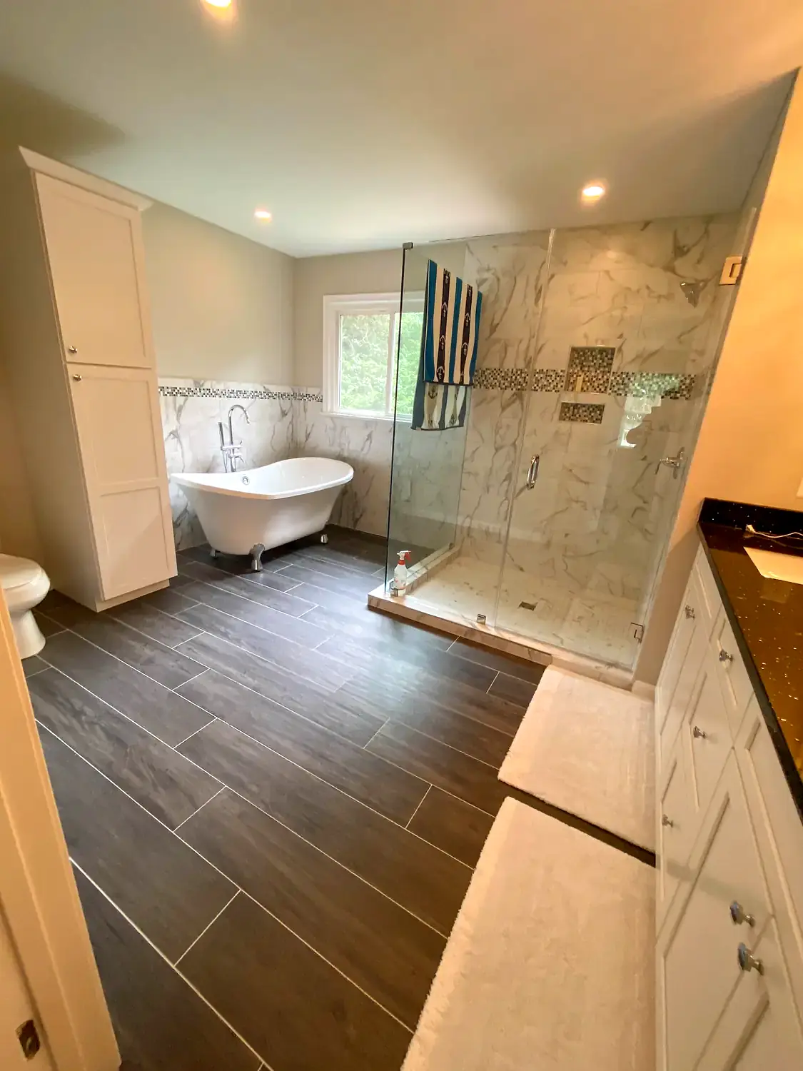 Primary bathroom with soaking tub, bathroom remodeling project in Northern Virginia by HOM Design & Build, view 1