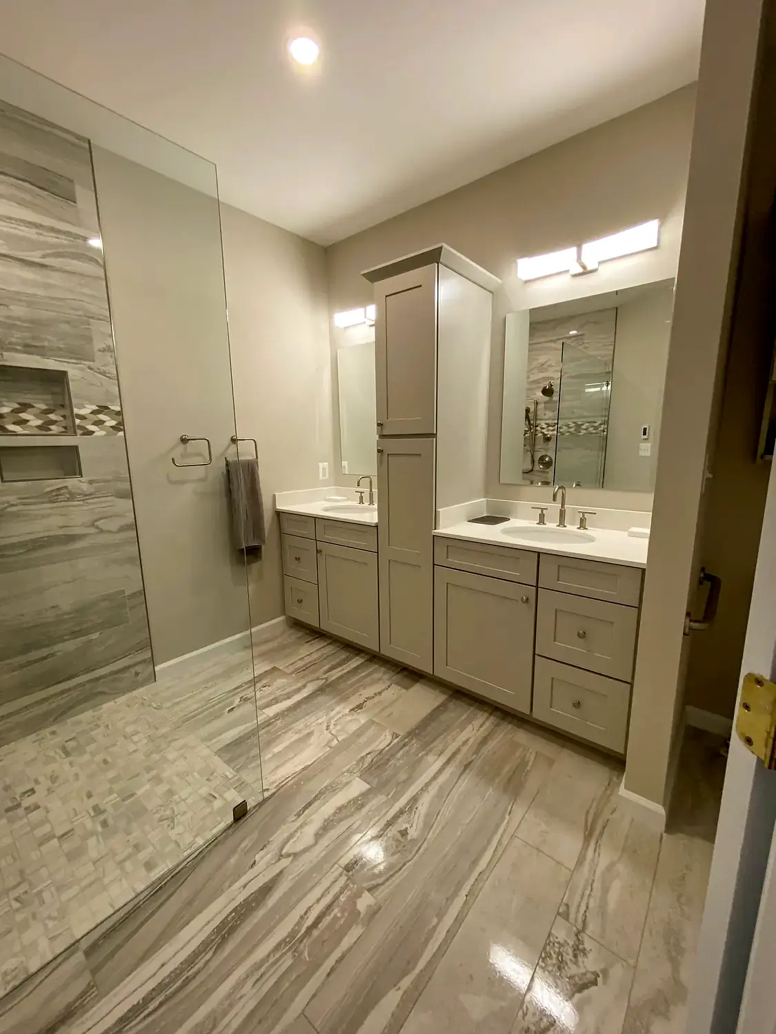 Large-format marble shower, bathroom remodeling project in Northern Virginia by HOM Design & Build, view 2