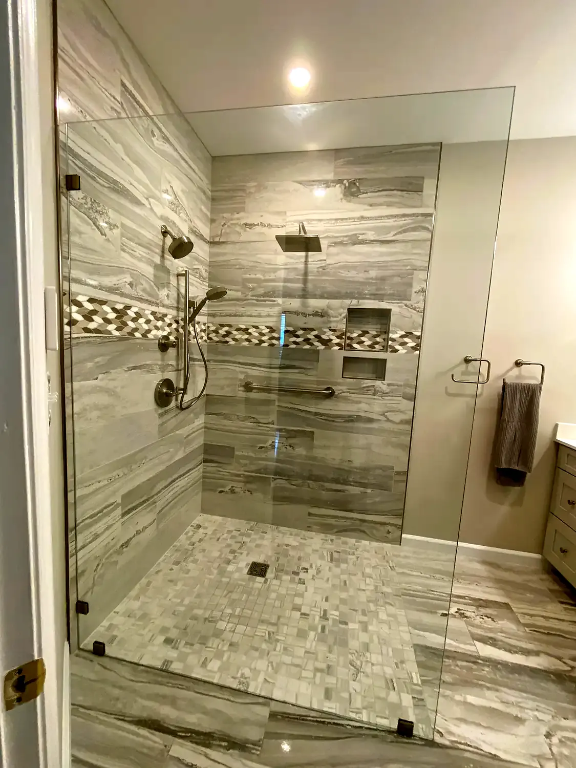 Large-format marble shower, bathroom remodeling project in Northern Virginia by HOM Design & Build, view 3