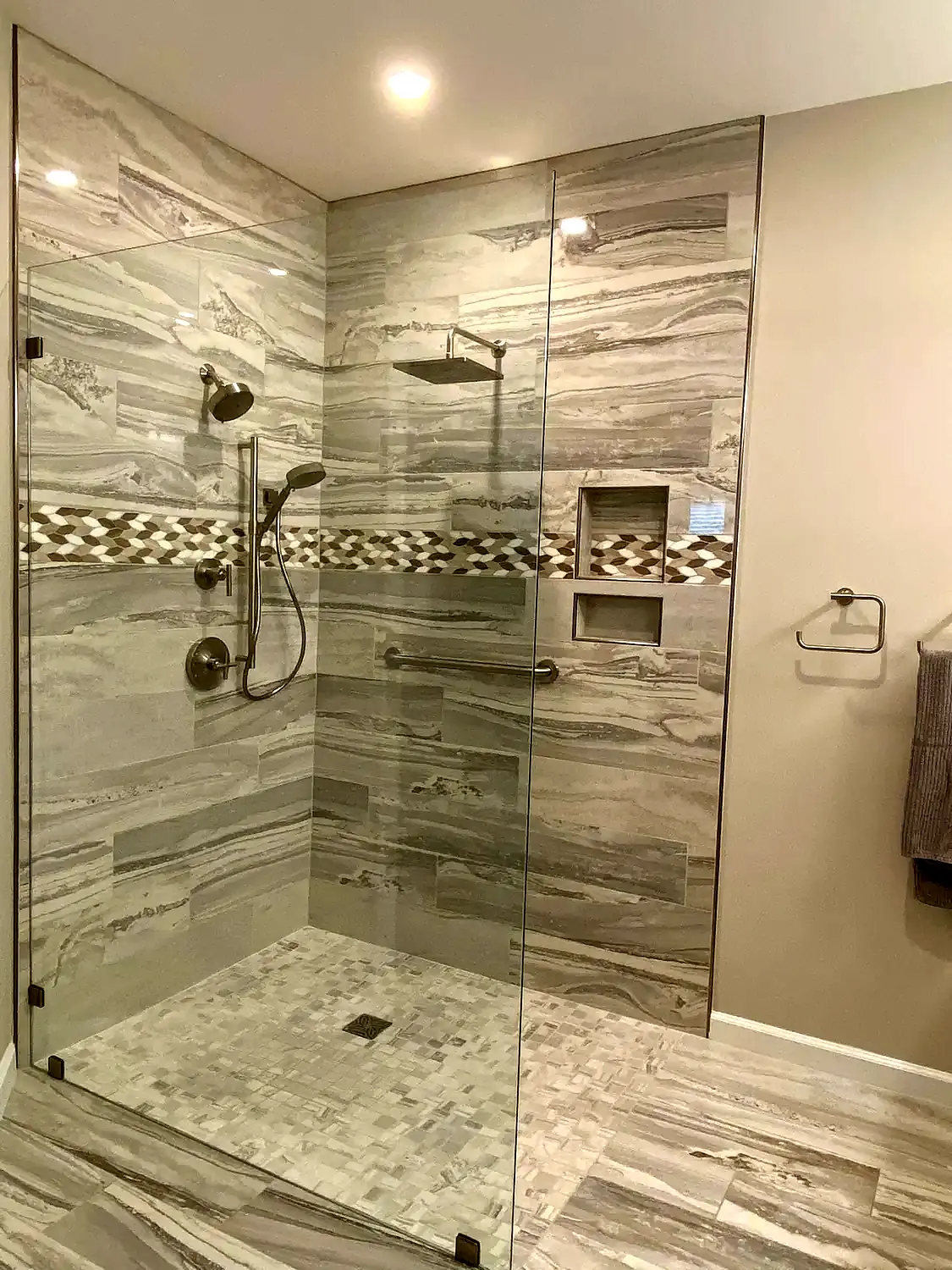 Large-format marble shower, bathroom remodeling project in Northern Virginia by HOM Design & Build, view 4