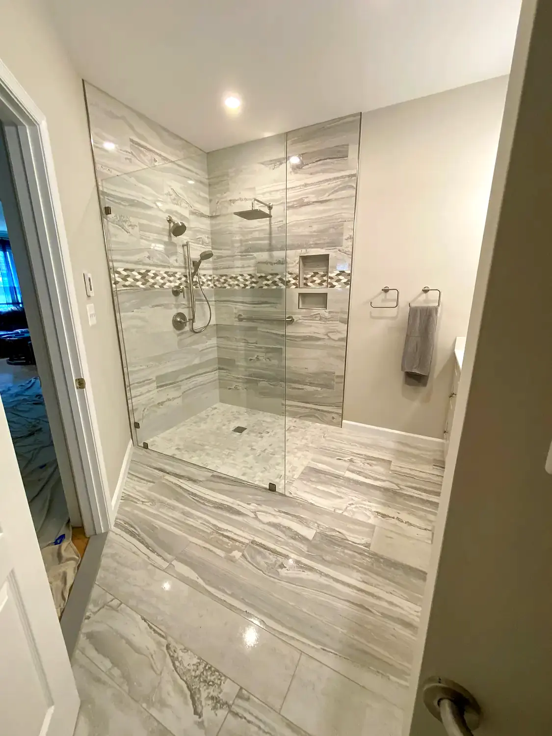 Large-format marble shower, bathroom remodeling project in Northern Virginia by HOM Design & Build, view 5