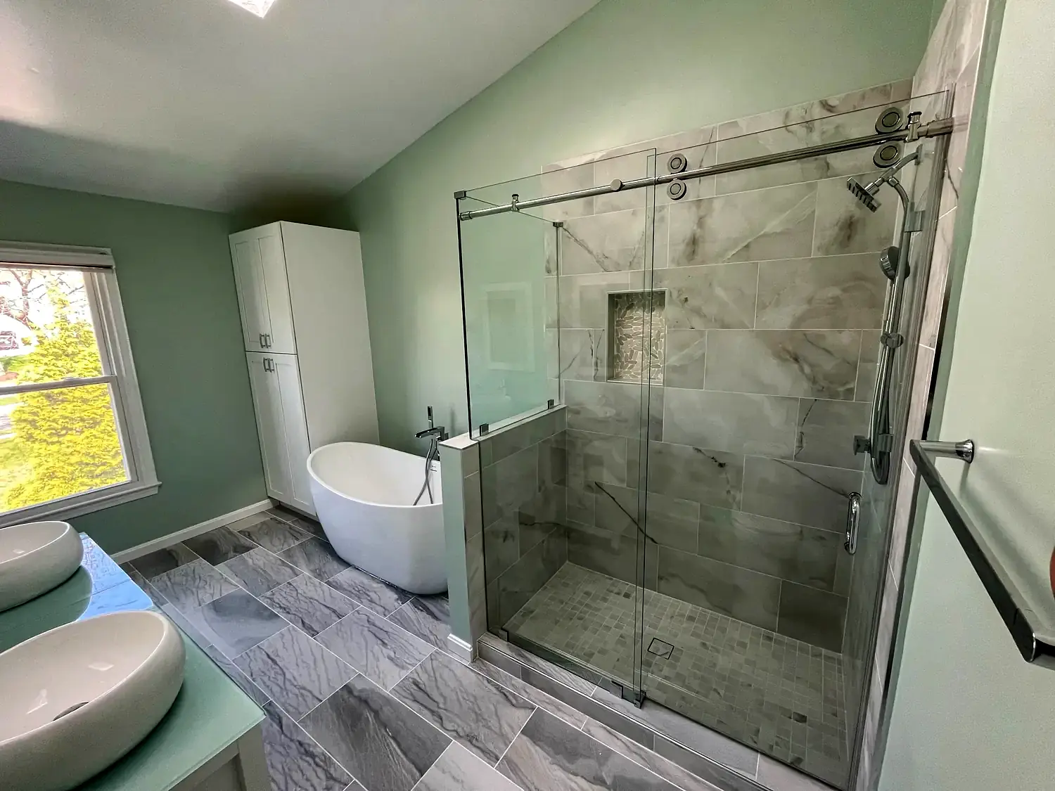 Green primary bathroom, bathroom remodeling project in Northern Virginia by HOM Design & Build, view 3