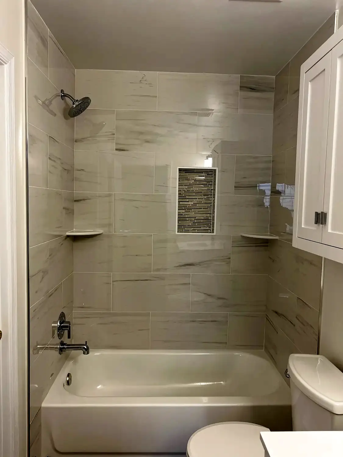 Bright tub-shower bathroom, bathroom remodeling project in Northern Virginia by HOM Design & Build, view 1
