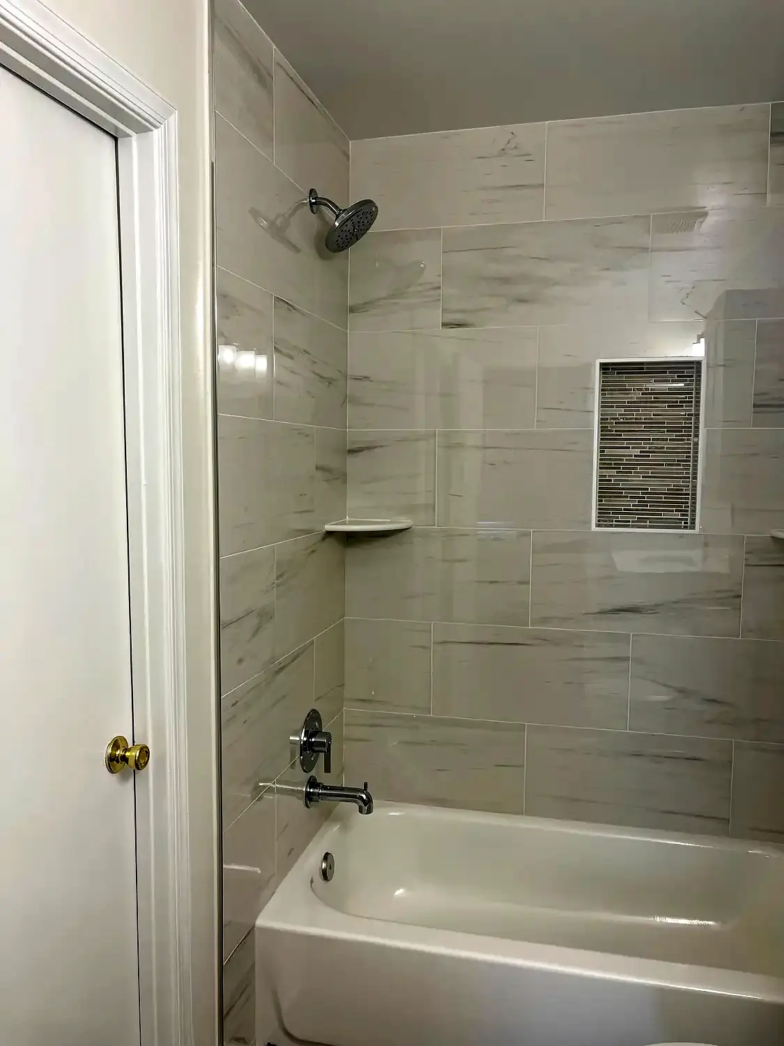 Bright tub-shower bathroom, bathroom remodeling project in Northern Virginia by HOM Design & Build, view 3