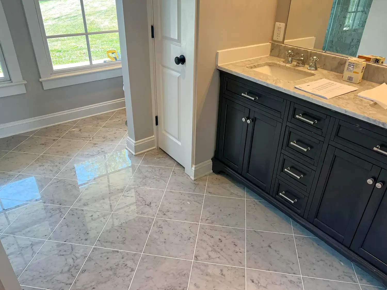 Tile floor and bathroom transitions, flooring project in Northern Virginia by HOM Design & Build, view 1