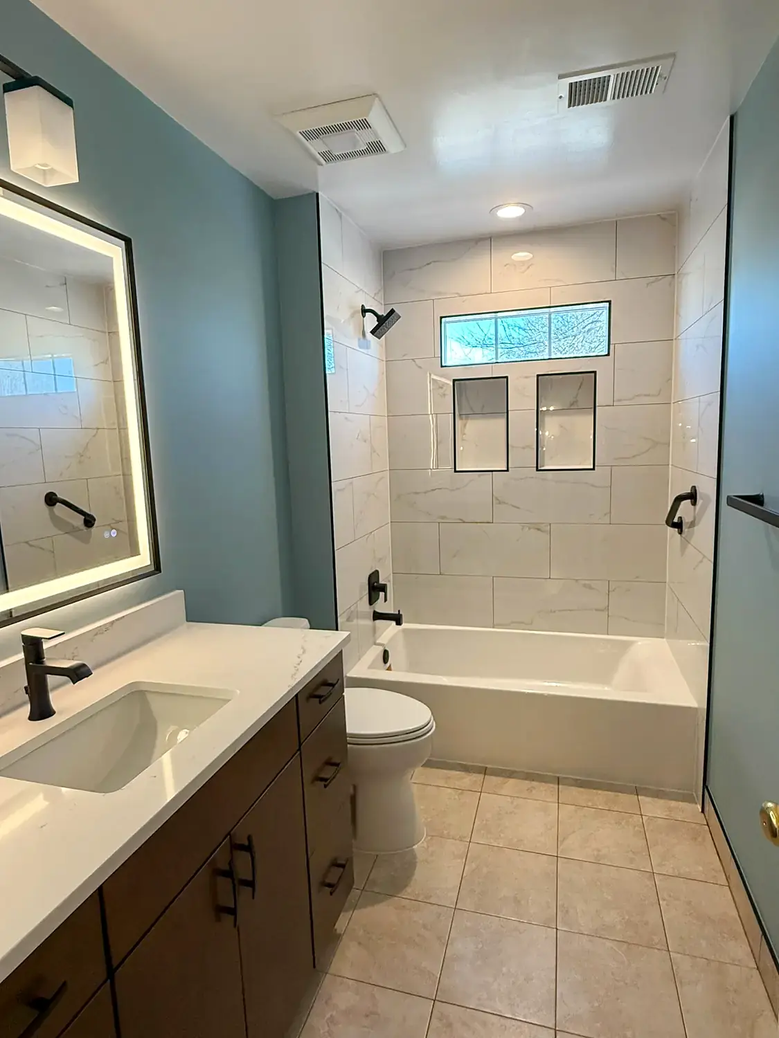 Blue hall bathroom, bathroom remodeling project in Northern Virginia by HOM Design & Build, view 1