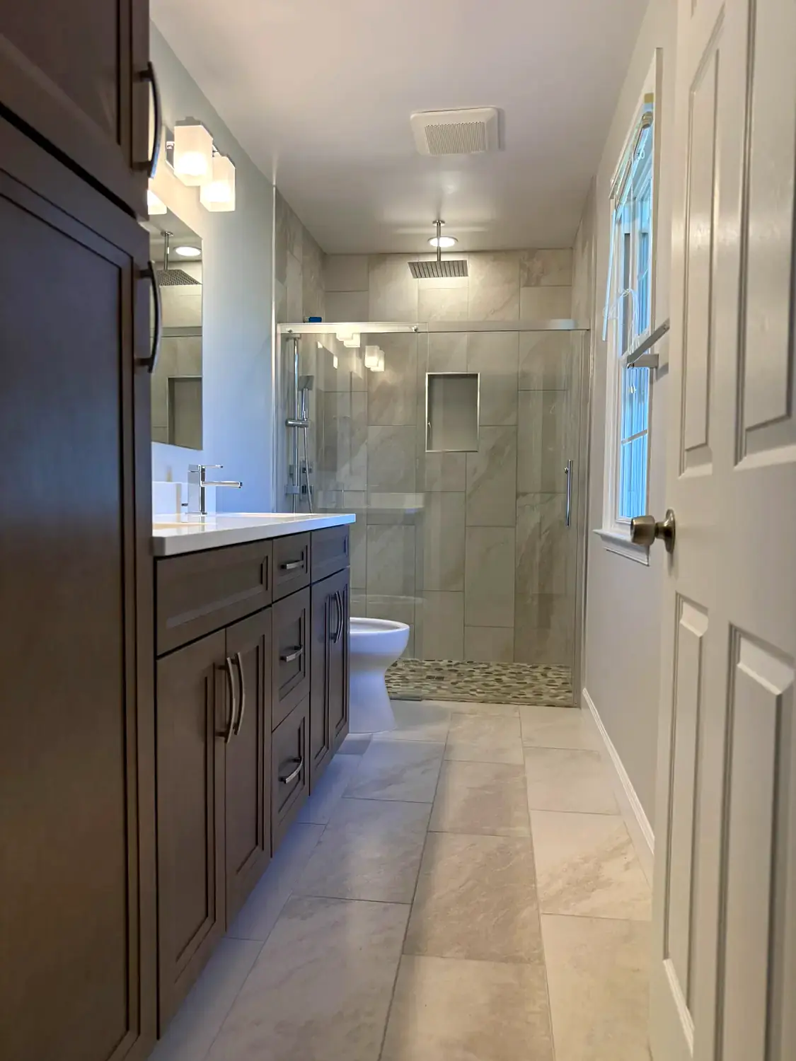 Neutral walk-in shower, bathroom remodeling project in Northern Virginia by HOM Design & Build, view 1