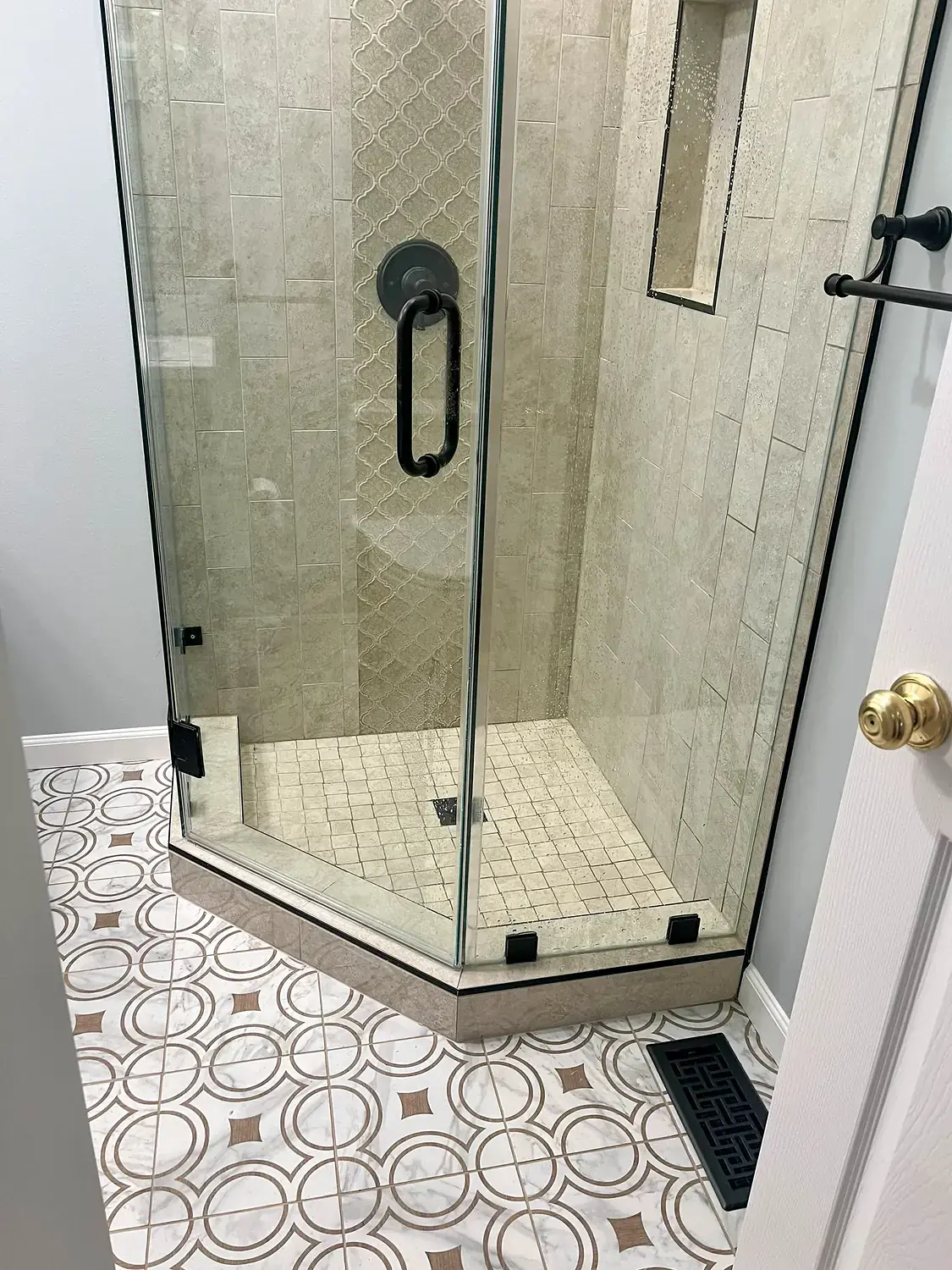 Patterned-floor glass shower, bathroom remodeling project in Northern Virginia by HOM Design & Build, view 2
