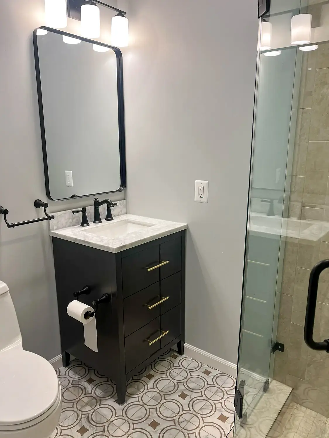 Patterned-floor glass shower, bathroom remodeling project in Northern Virginia by HOM Design & Build, view 3