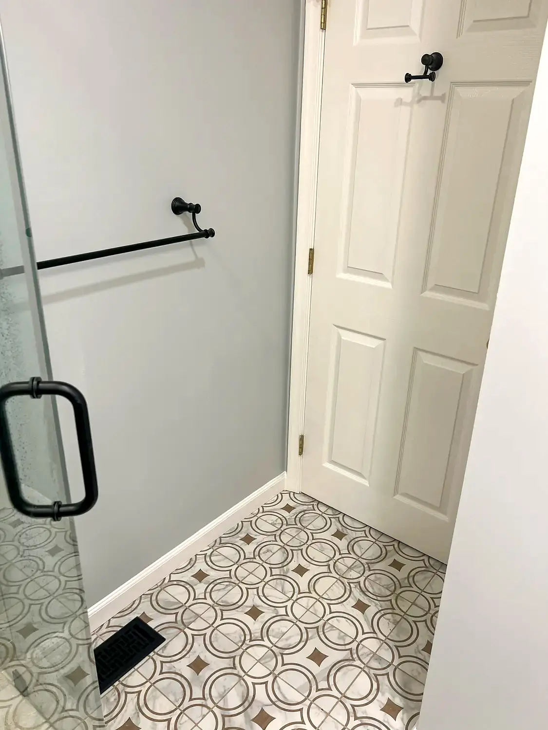 Patterned-floor glass shower, bathroom remodeling project in Northern Virginia by HOM Design & Build, view 5