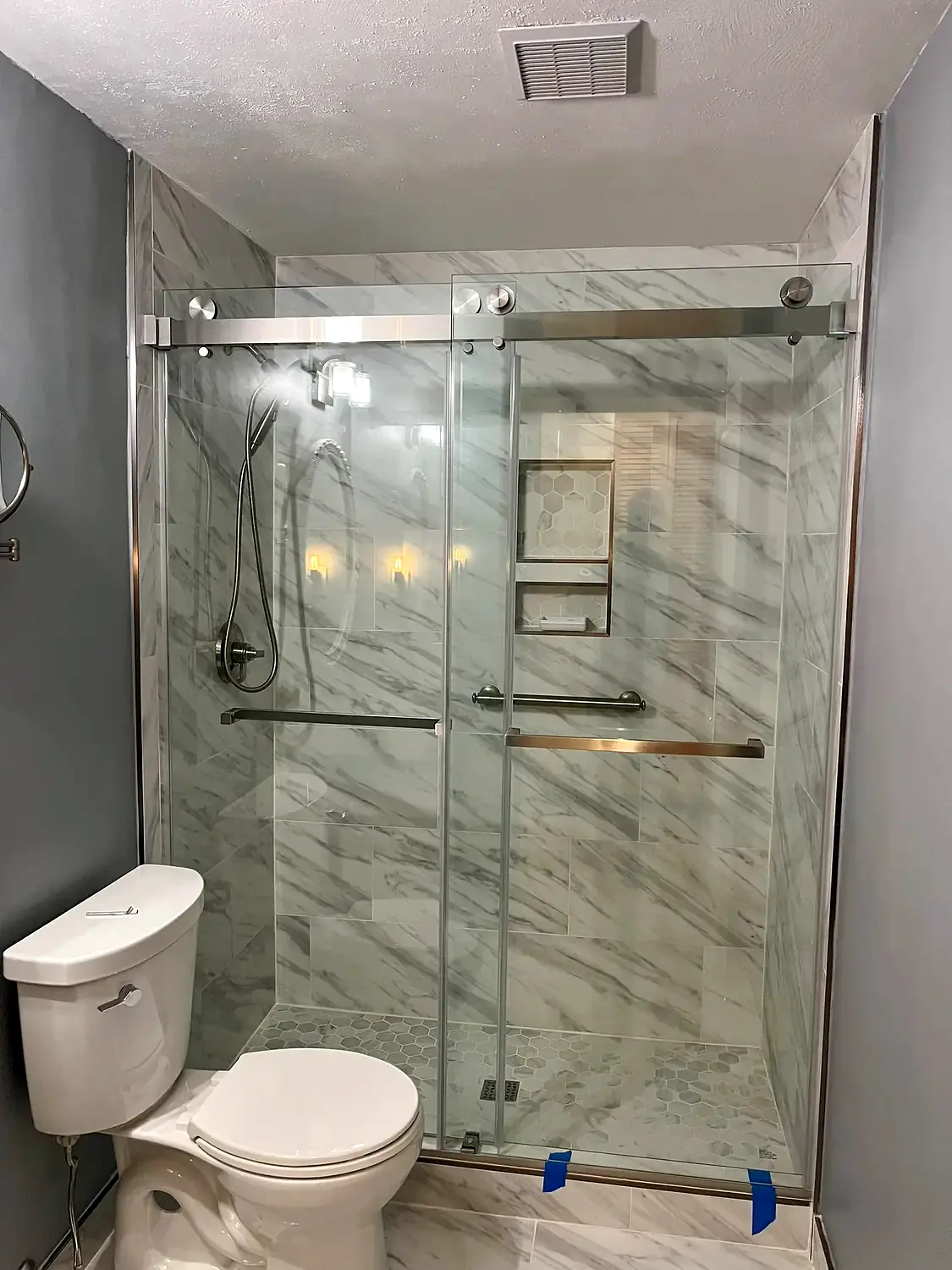 Patterned-floor glass shower, bathroom remodeling project in Northern Virginia by HOM Design & Build, view 6