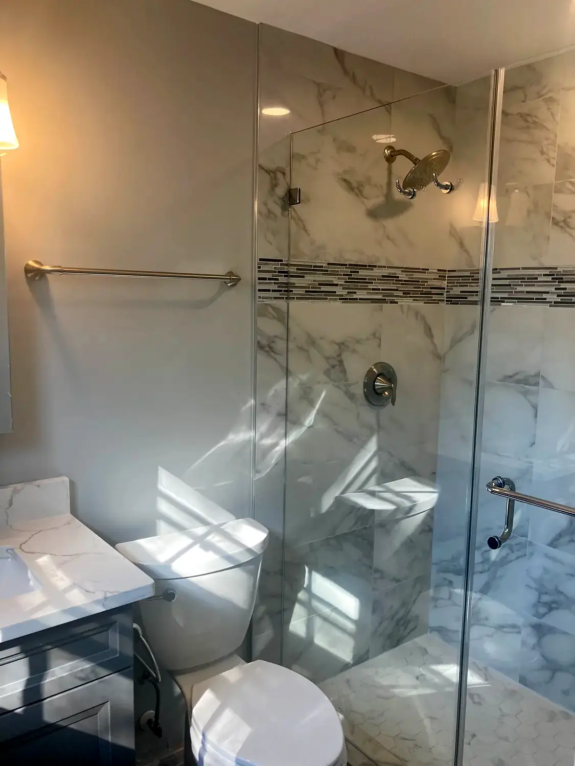 Marble corner shower, bathroom remodeling project in Northern Virginia by HOM Design & Build, view 4