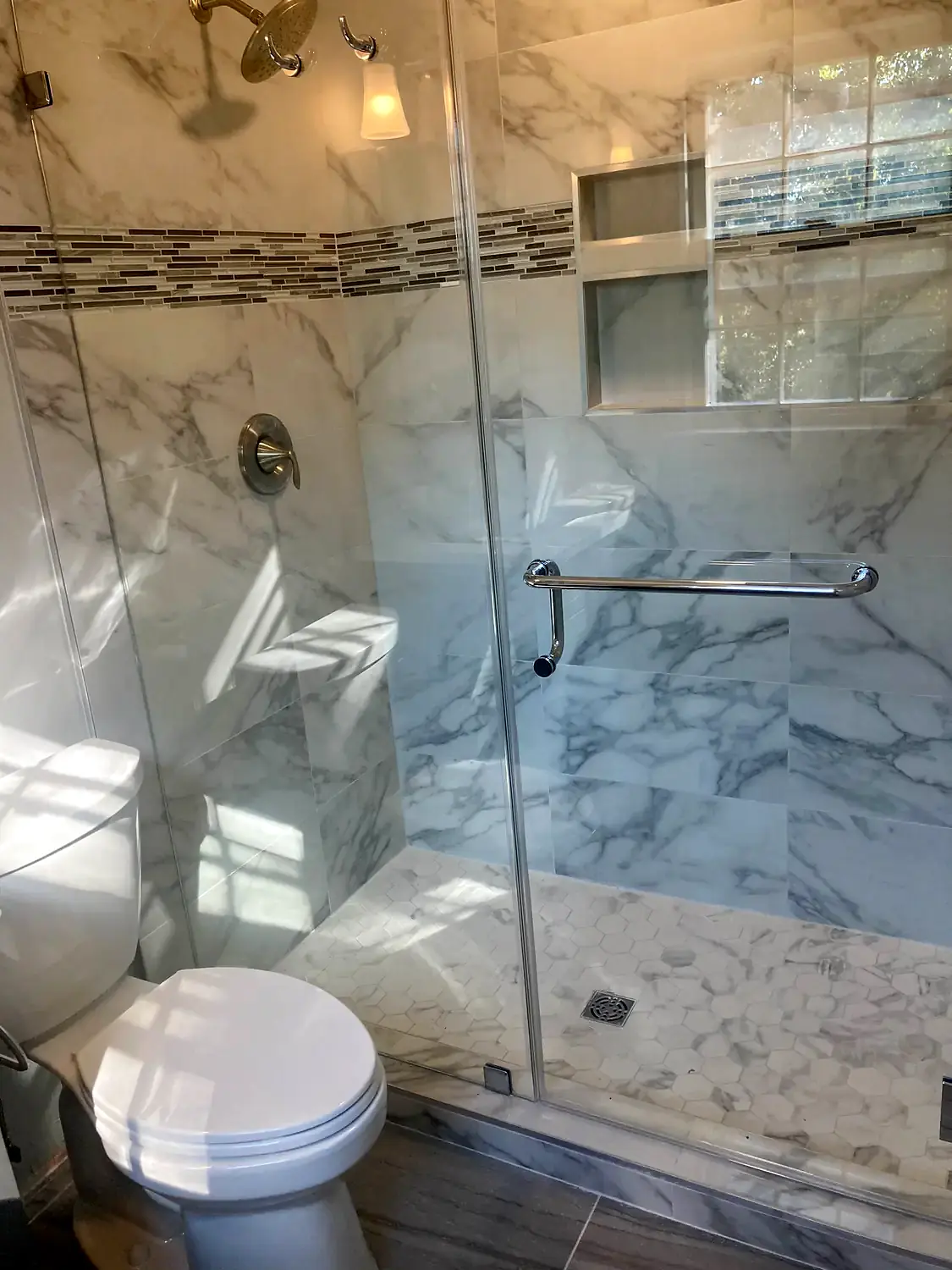 Marble corner shower, bathroom remodeling project in Northern Virginia by HOM Design & Build, view 8