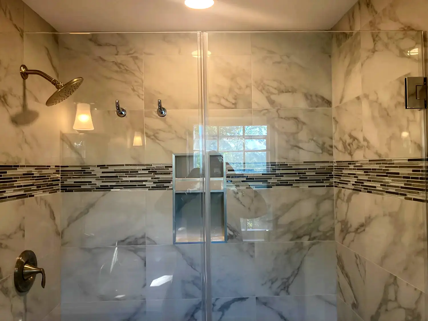 Marble corner shower, bathroom remodeling project in Northern Virginia by HOM Design & Build, view 10