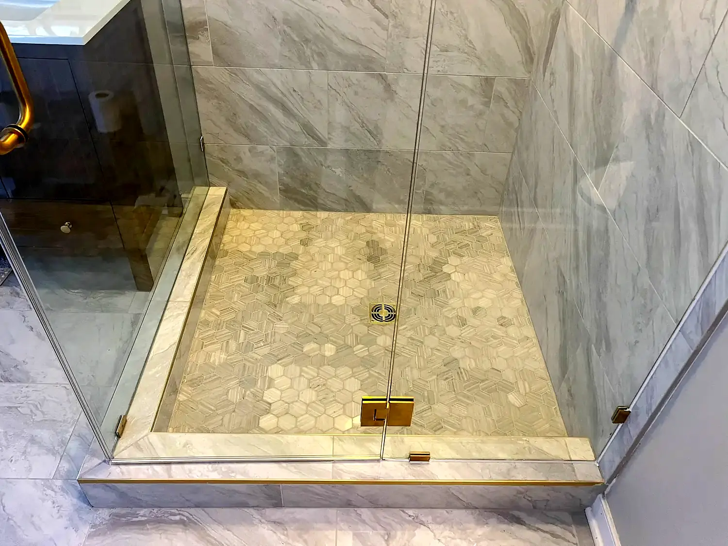 Brass shower suite, bathroom remodeling project in Northern Virginia by HOM Design & Build, view 1