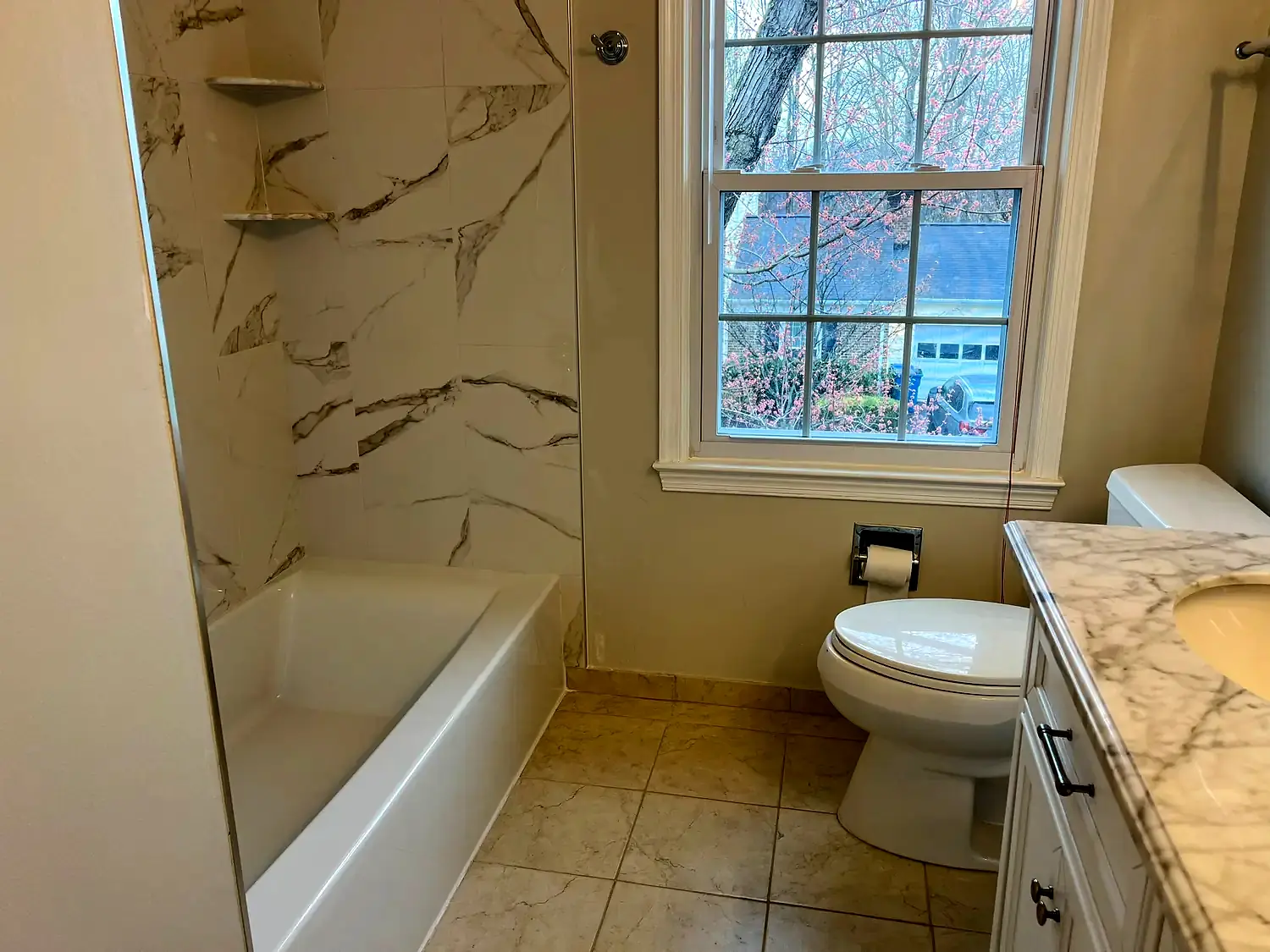 Large-format tub surround, bathroom remodeling project in Northern Virginia by HOM Design & Build, view 1