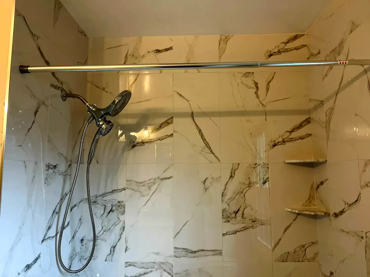 Large-format tub surround, bathroom remodeling project in Northern Virginia by HOM Design & Build, view 6